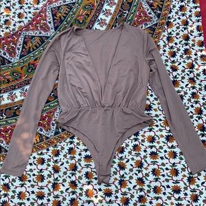 Tan v-shaped bodysuit